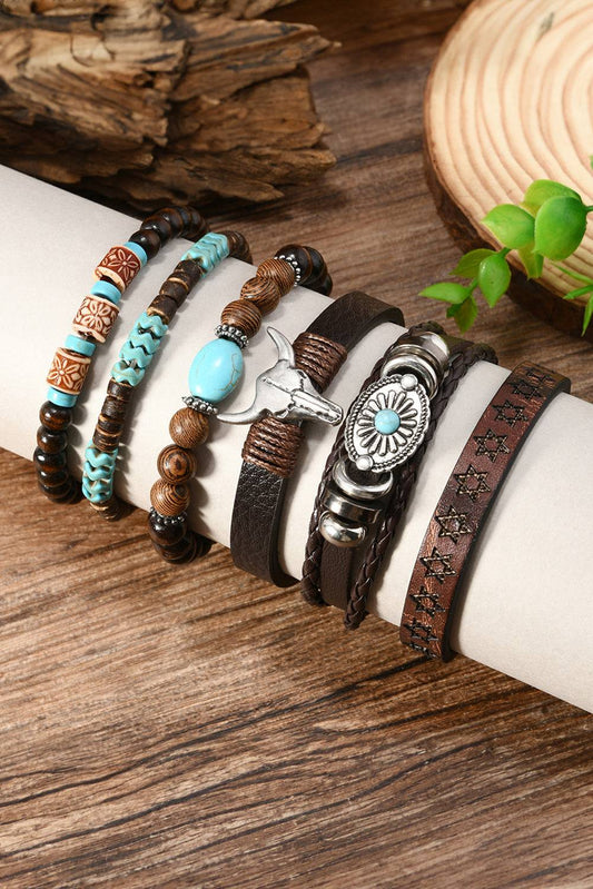 Set of bracelets on a wrist with wooden background
