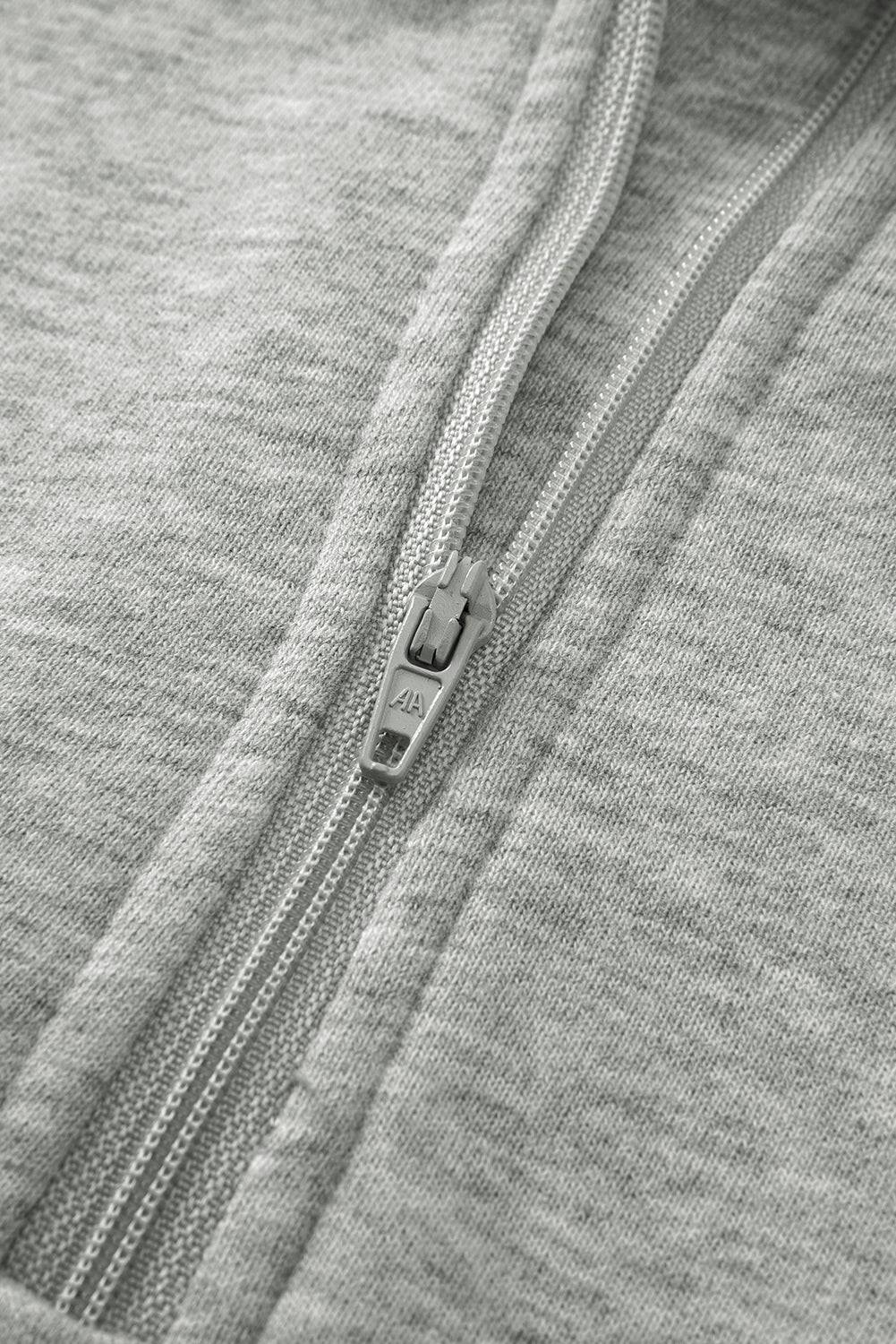 Close-up of a zipper on gray fabric