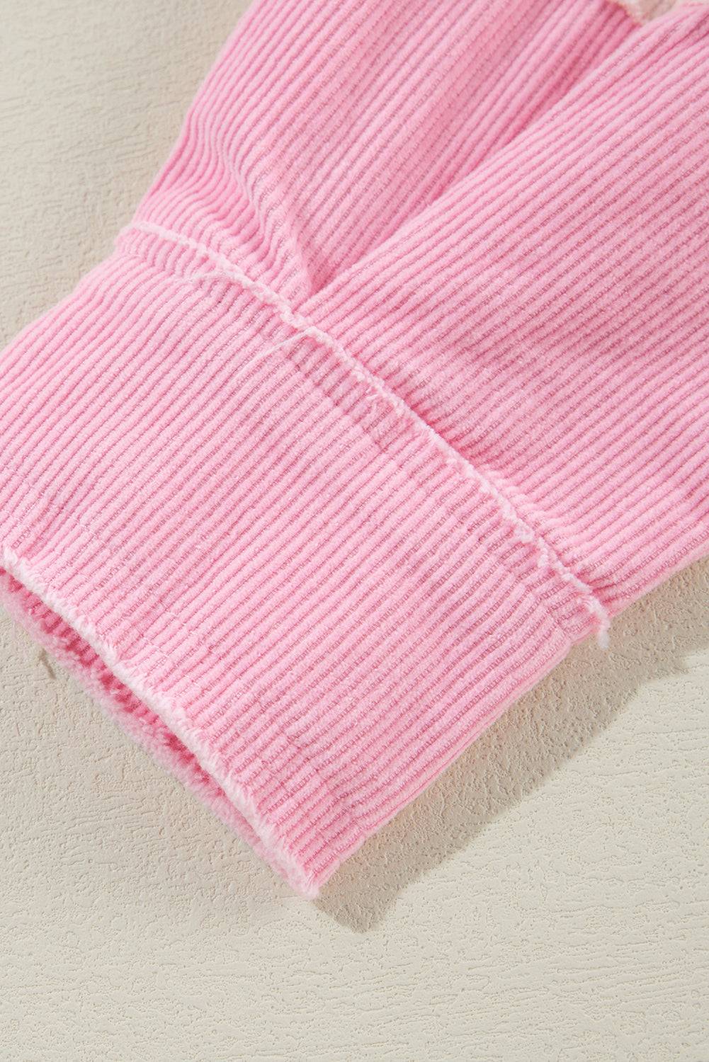 Close-up of a pink textured fabric on a light background