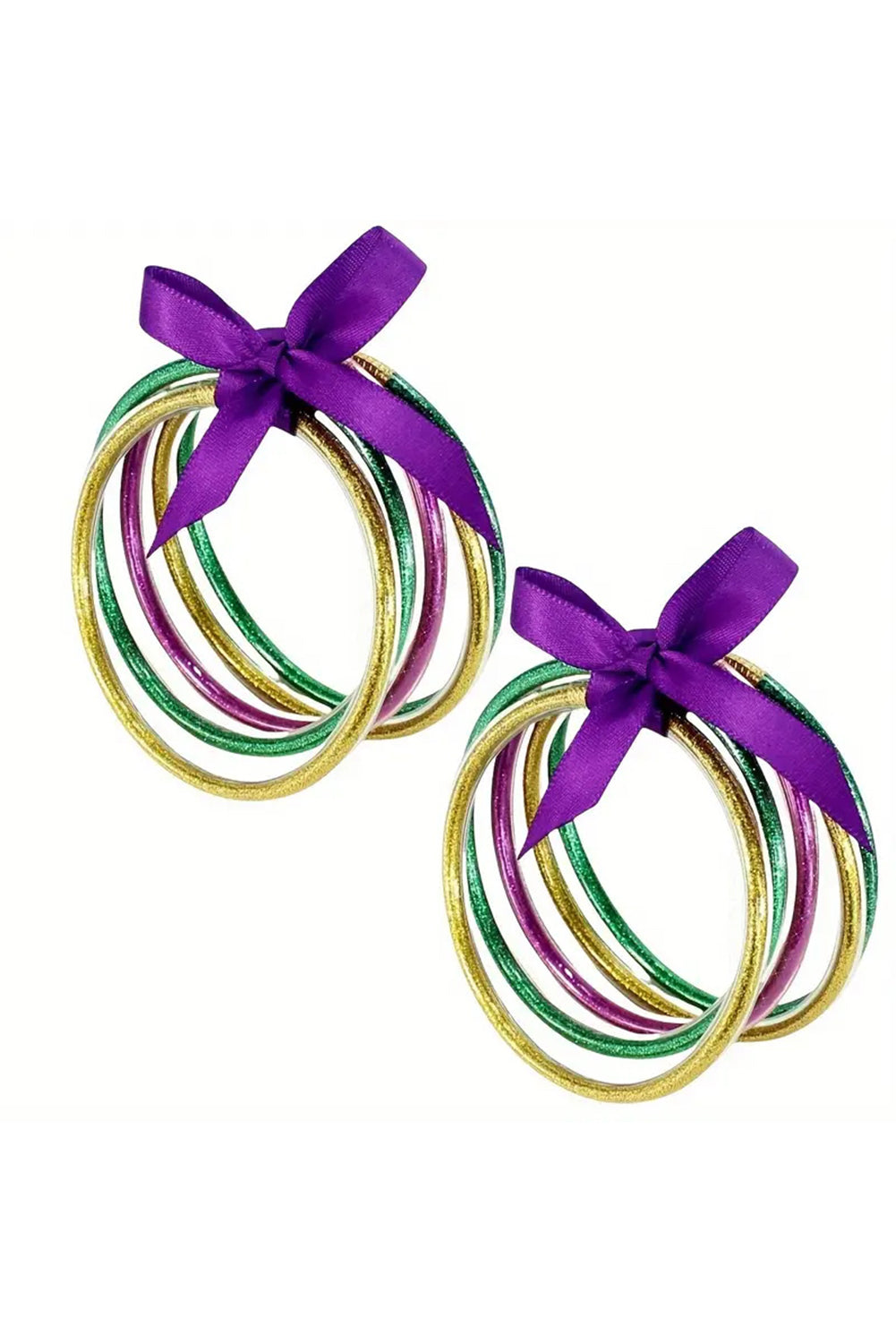 Two circular decorations with ribbons on a white background