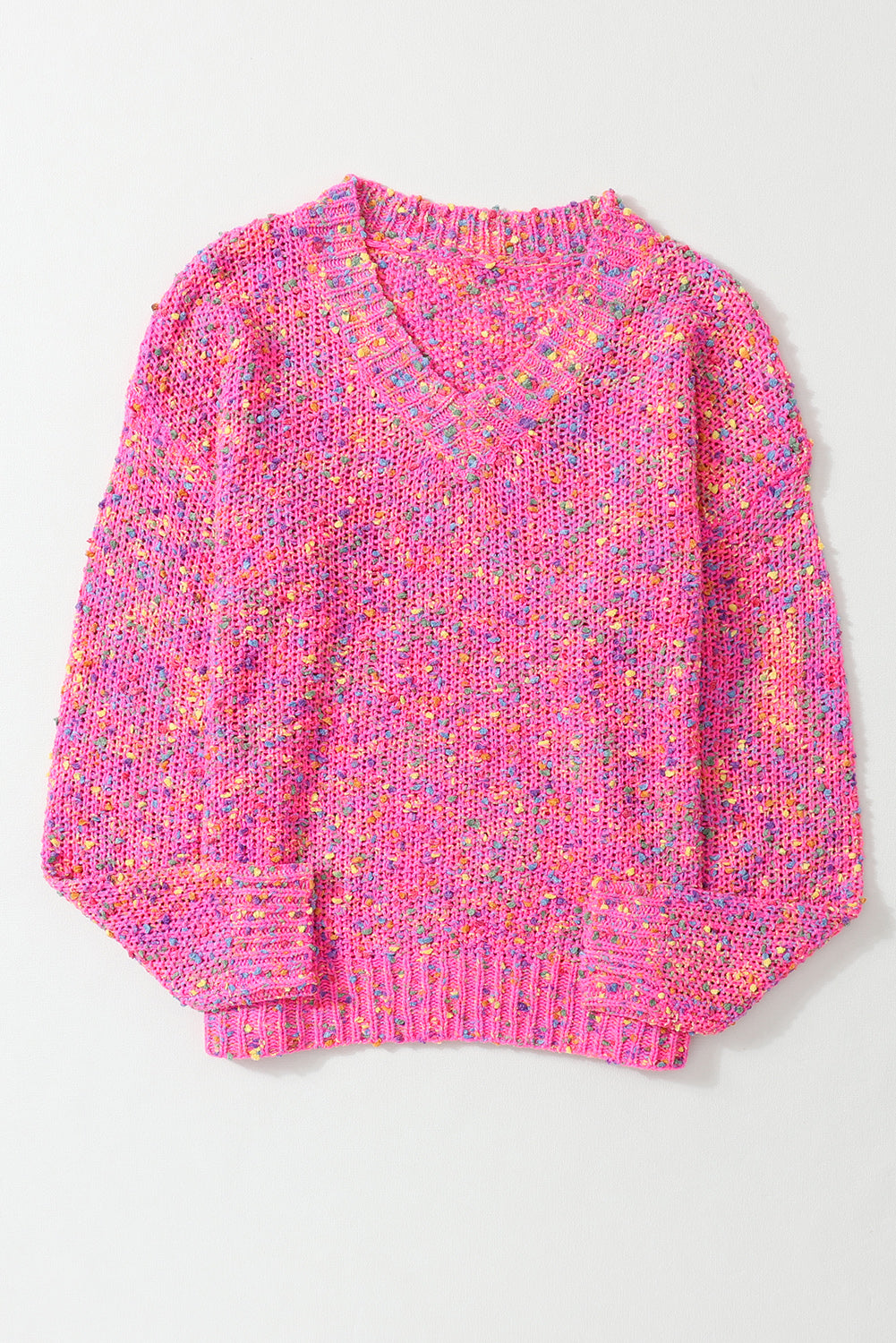 Pink knitted sweater with multicolor pattern on a white background