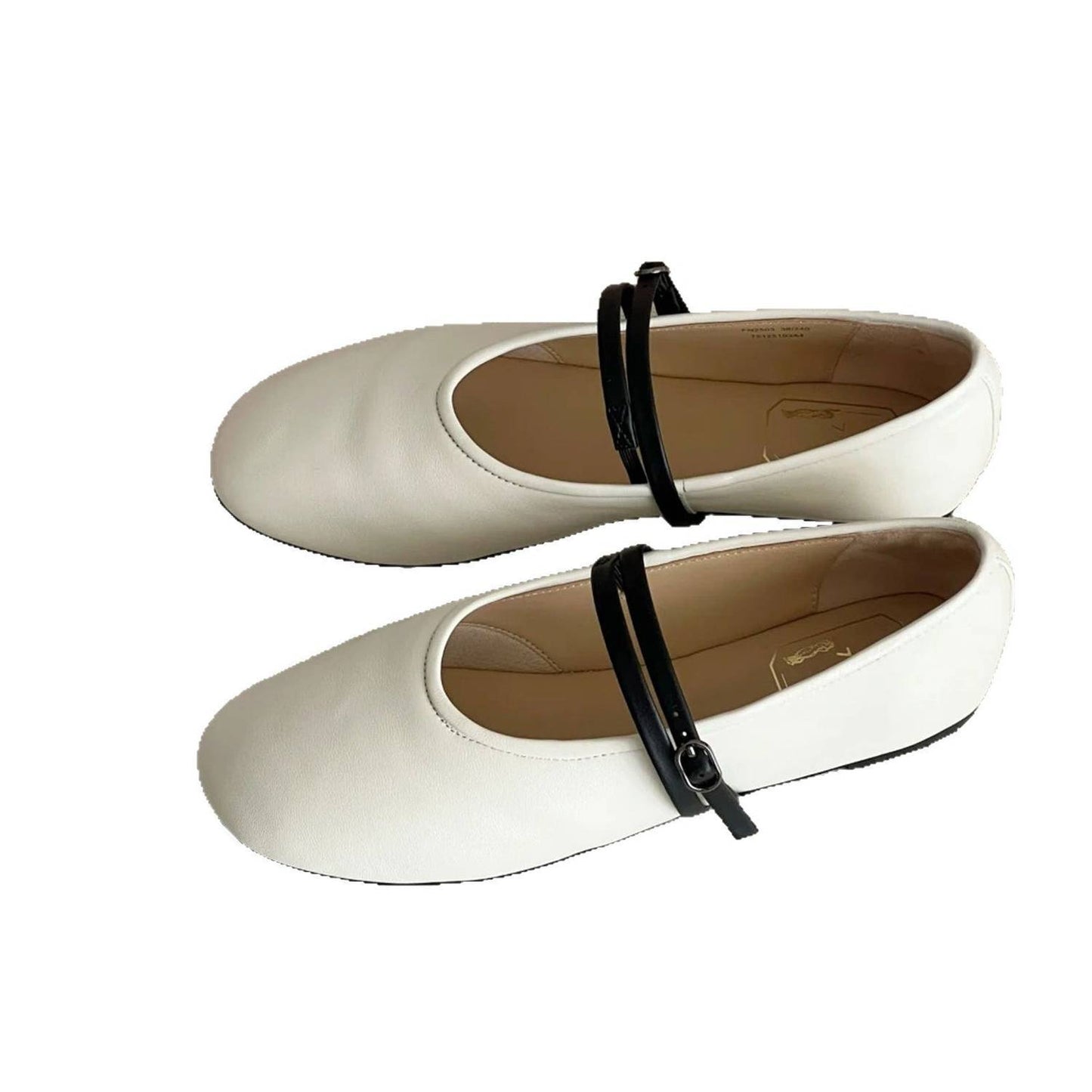 White ballerina shoes with a black ankle strap on a white background