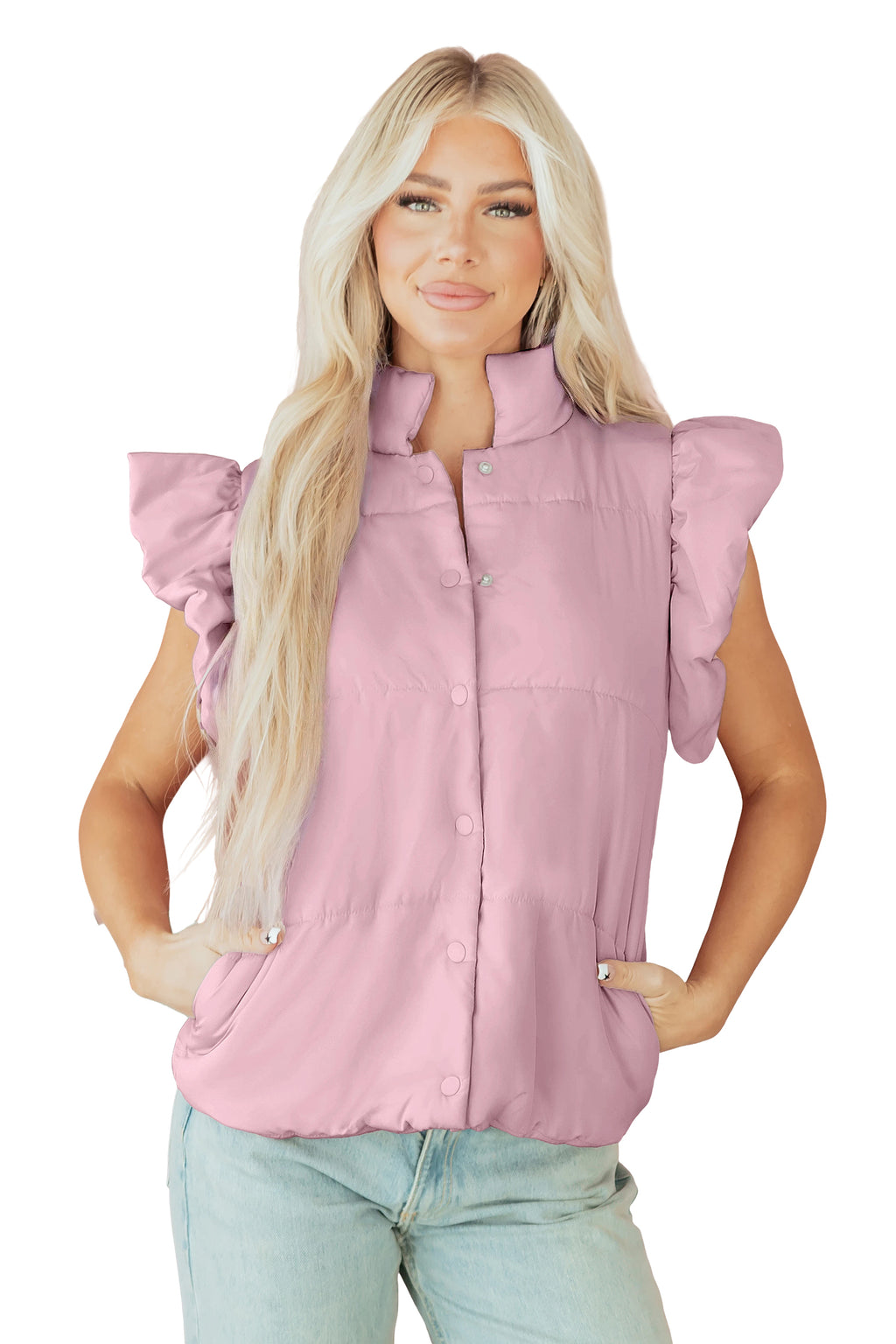 Woman wearing a pink sleeveless jacket with ruffled sleeves on a white background