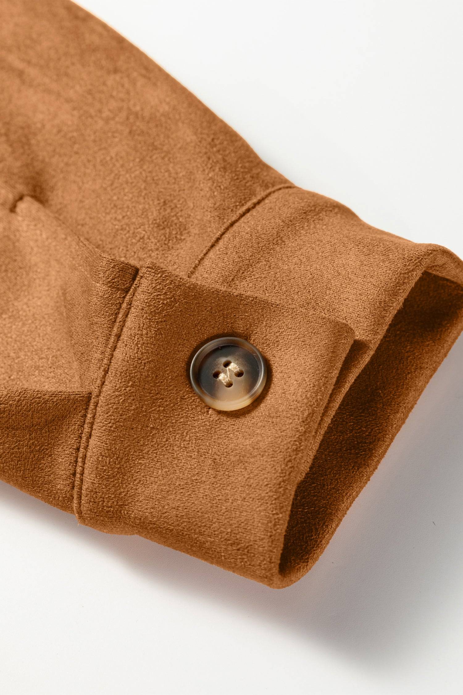 Close-up of a brown fabric with a button on a white background