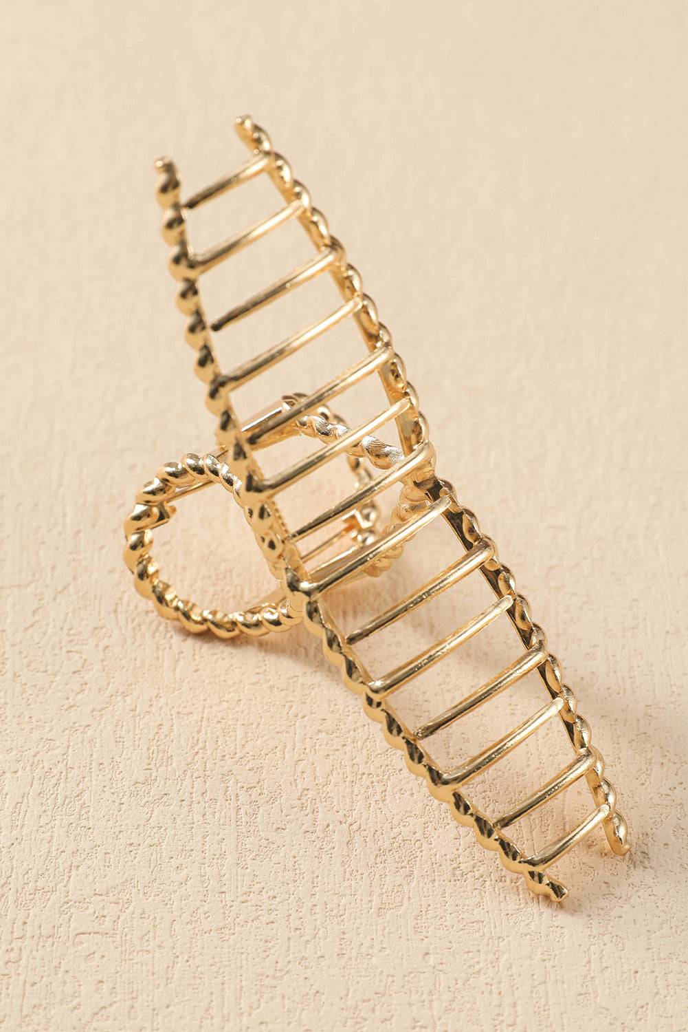 Gold ladder-shaped brooch on a beige background