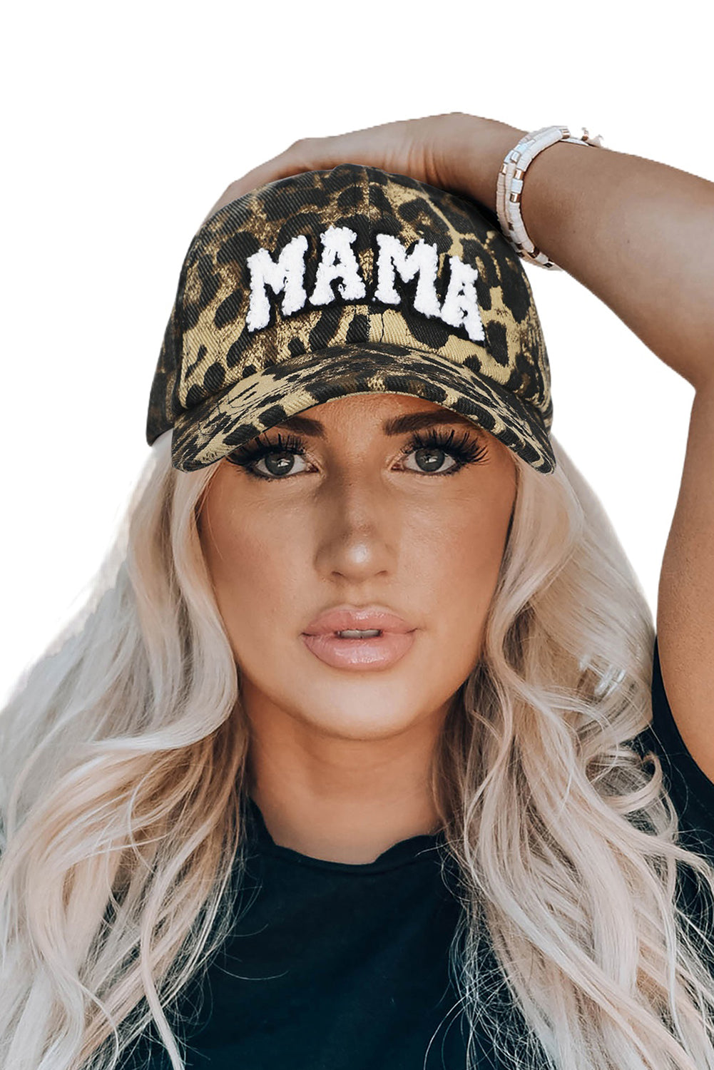 Person wearing a leopard print cap with 'MAMA' text on a white background