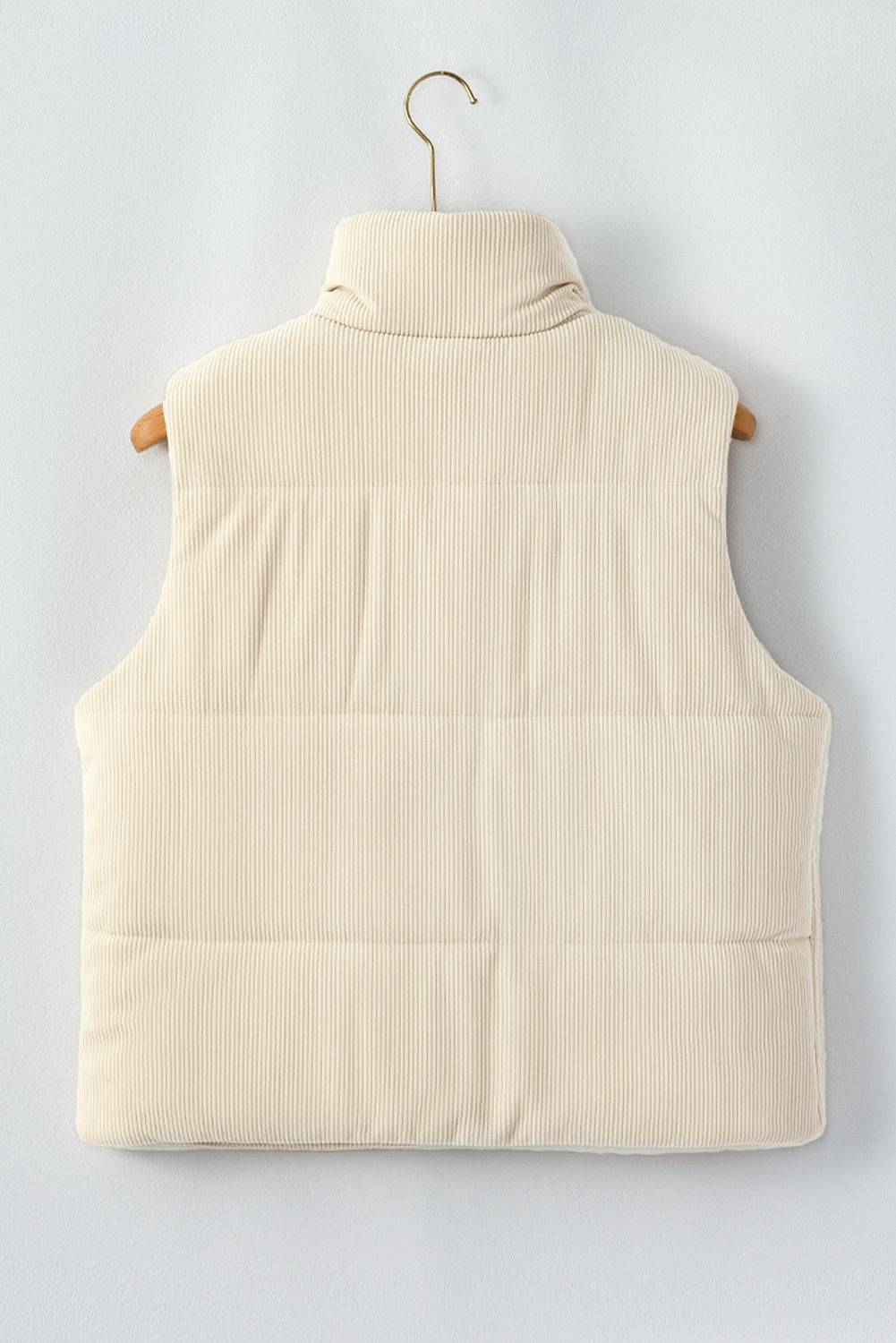 Beige puffer vest on a hanger against a light gray background