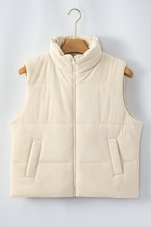 Beige puffer vest on a wooden hanger against a light gray background