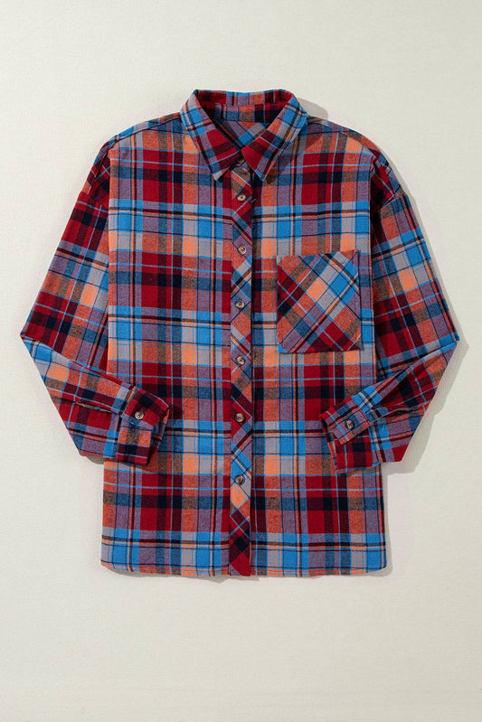 Plaid shirt with red, blue, and orange pattern on a beige background